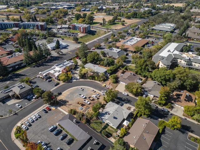 an aerial view of residential houses with outdoor space
