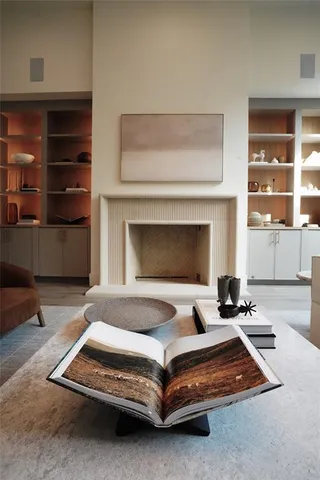 a bedroom with a bed and a fireplace