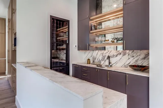 a living room with stainless steel appliances kitchen island granite countertop furniture and a window