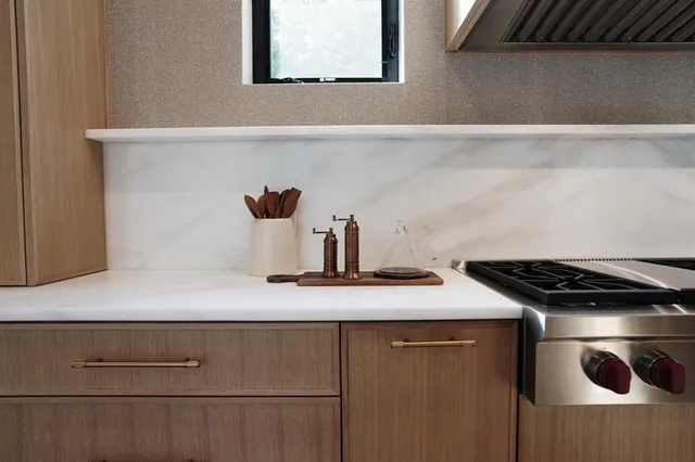 a kitchen with a stove and a cabinets