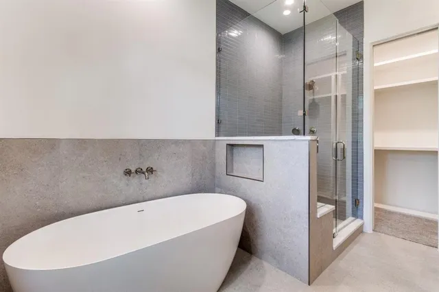 a living room with furniture and a mirror