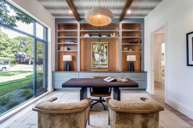a view of a patio with table and chairs