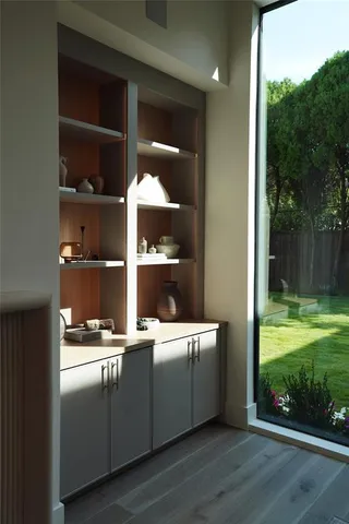 a room with a wooden floor and shoes