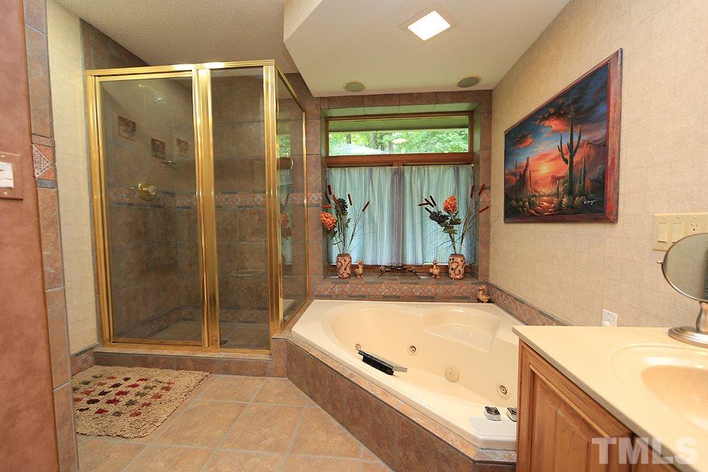 8009 Chadbourne Court Raleigh, NC 27613 - Photo 14 of 25 Master bath / spa with jetted tub and separate shower.