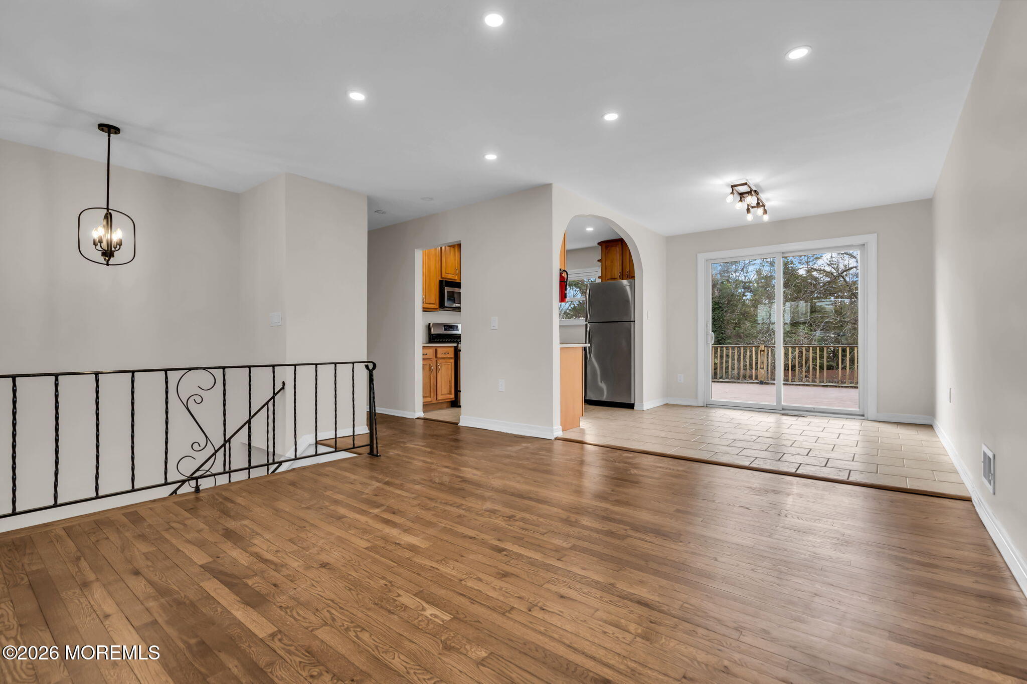 7 Spruce Terrace Jackson, NJ 08527 - Photo 11 of 49 a view of an empty room with wooden floor and a window