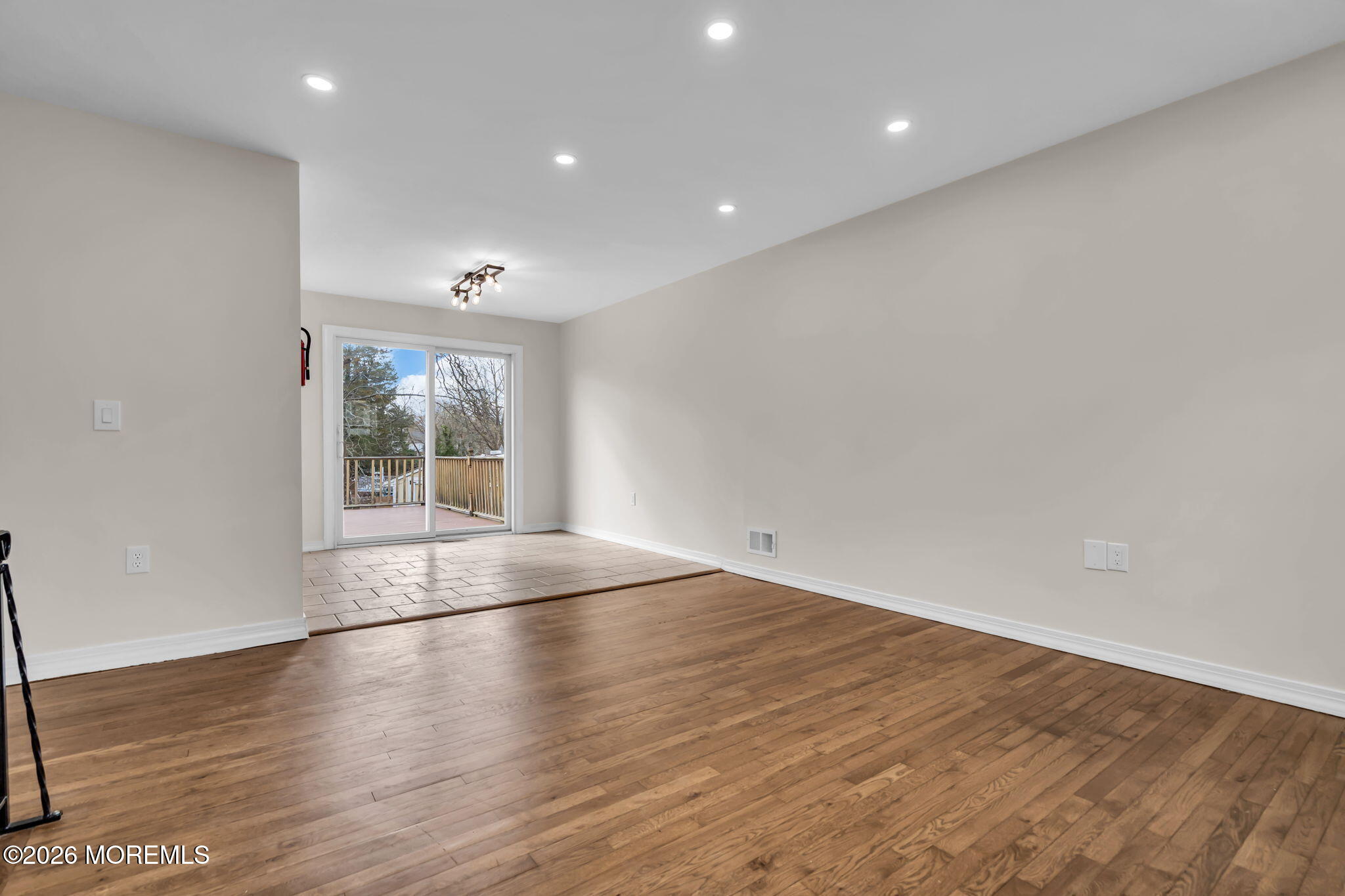 7 Spruce Terrace Jackson, NJ 08527 - Photo 12 of 49 an empty room with wooden floor and windows