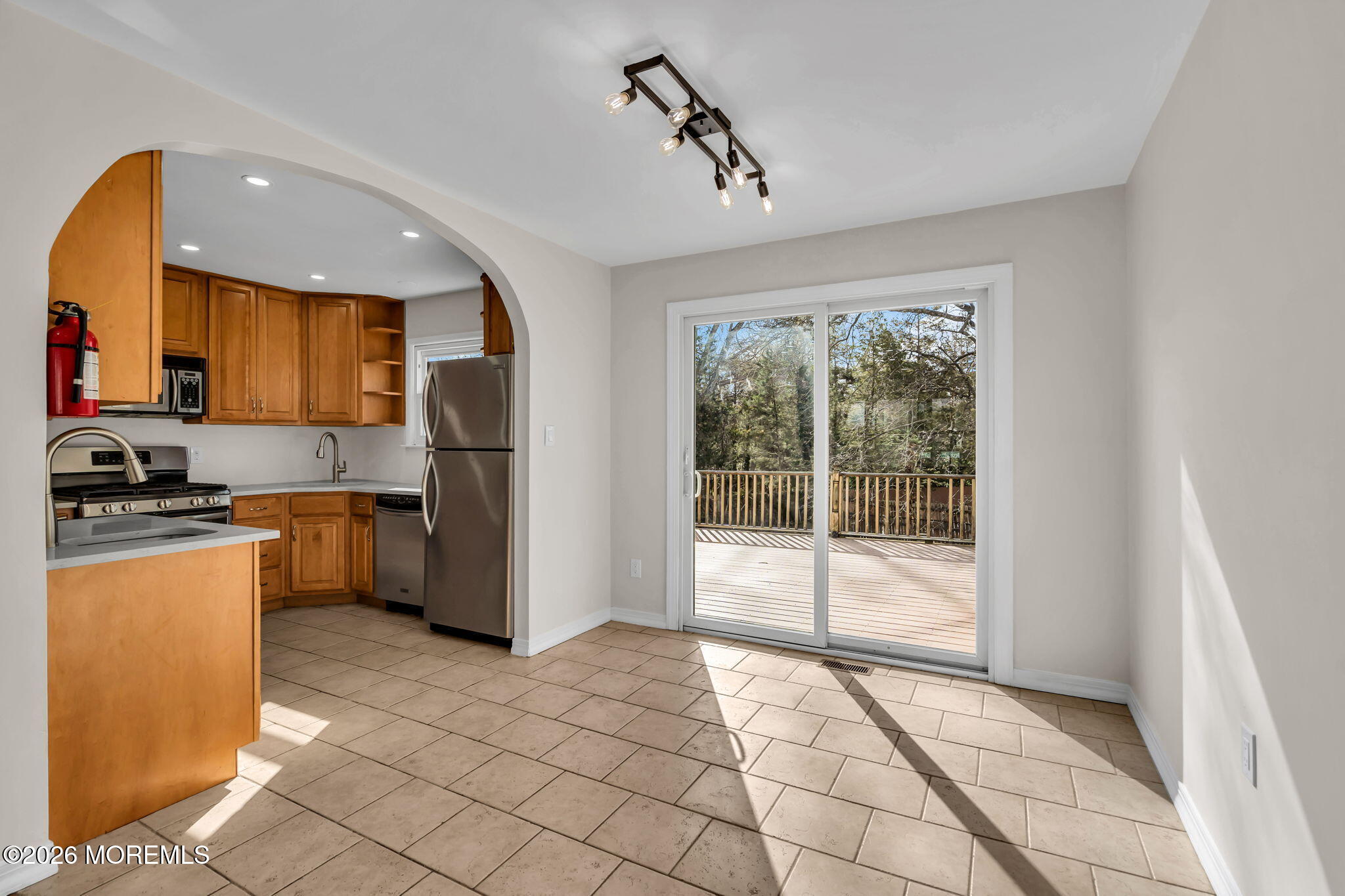 7 Spruce Terrace Jackson, NJ 08527 - Photo 16 of 49 a kitchen with stainless steel appliances granite countertop a stove a sink and a refrigerator with cabinets