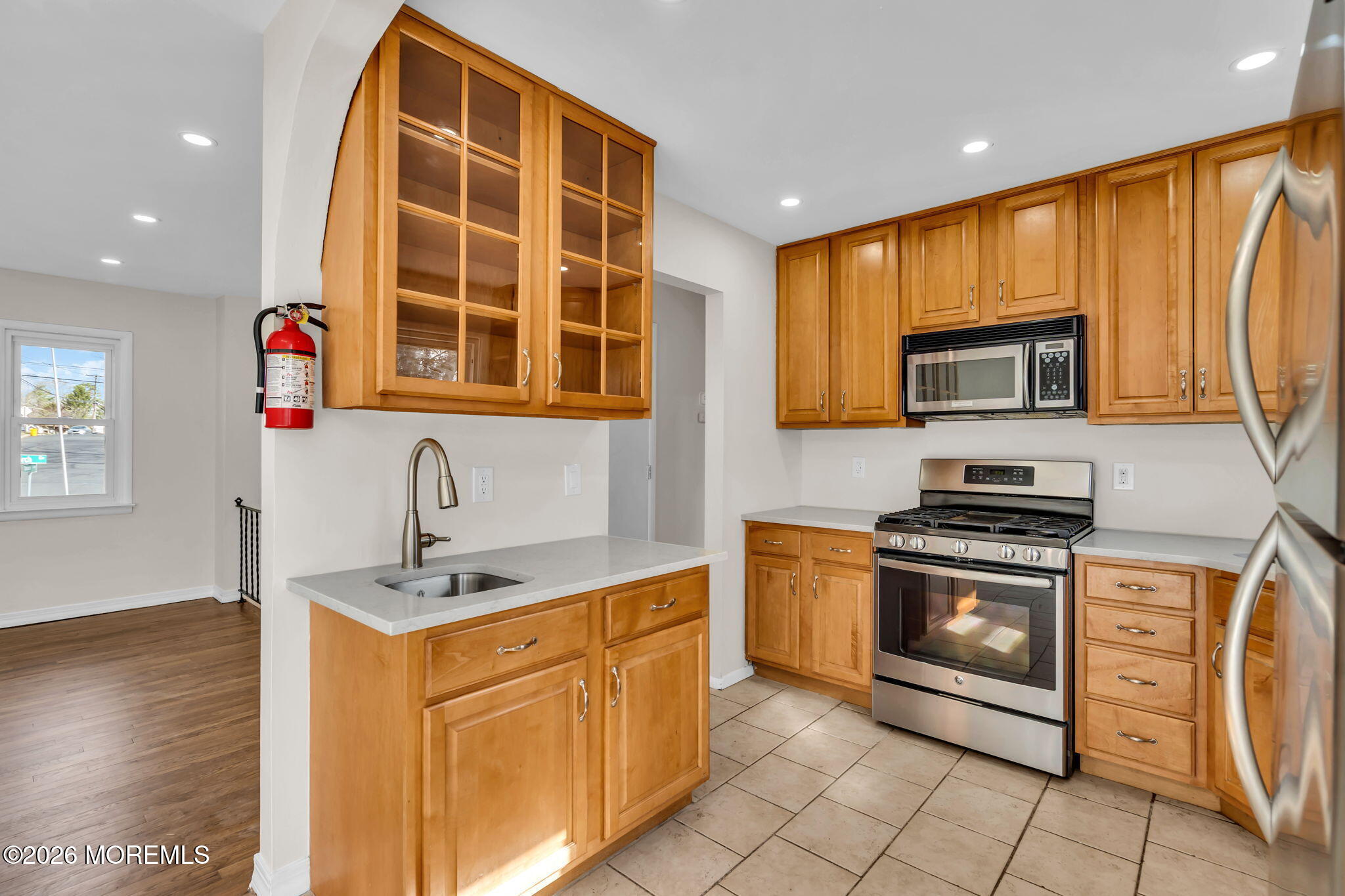 7 Spruce Terrace Jackson, NJ 08527 - Photo 19 of 49 a kitchen with stainless steel appliances granite countertop a stove a sink and a microwave