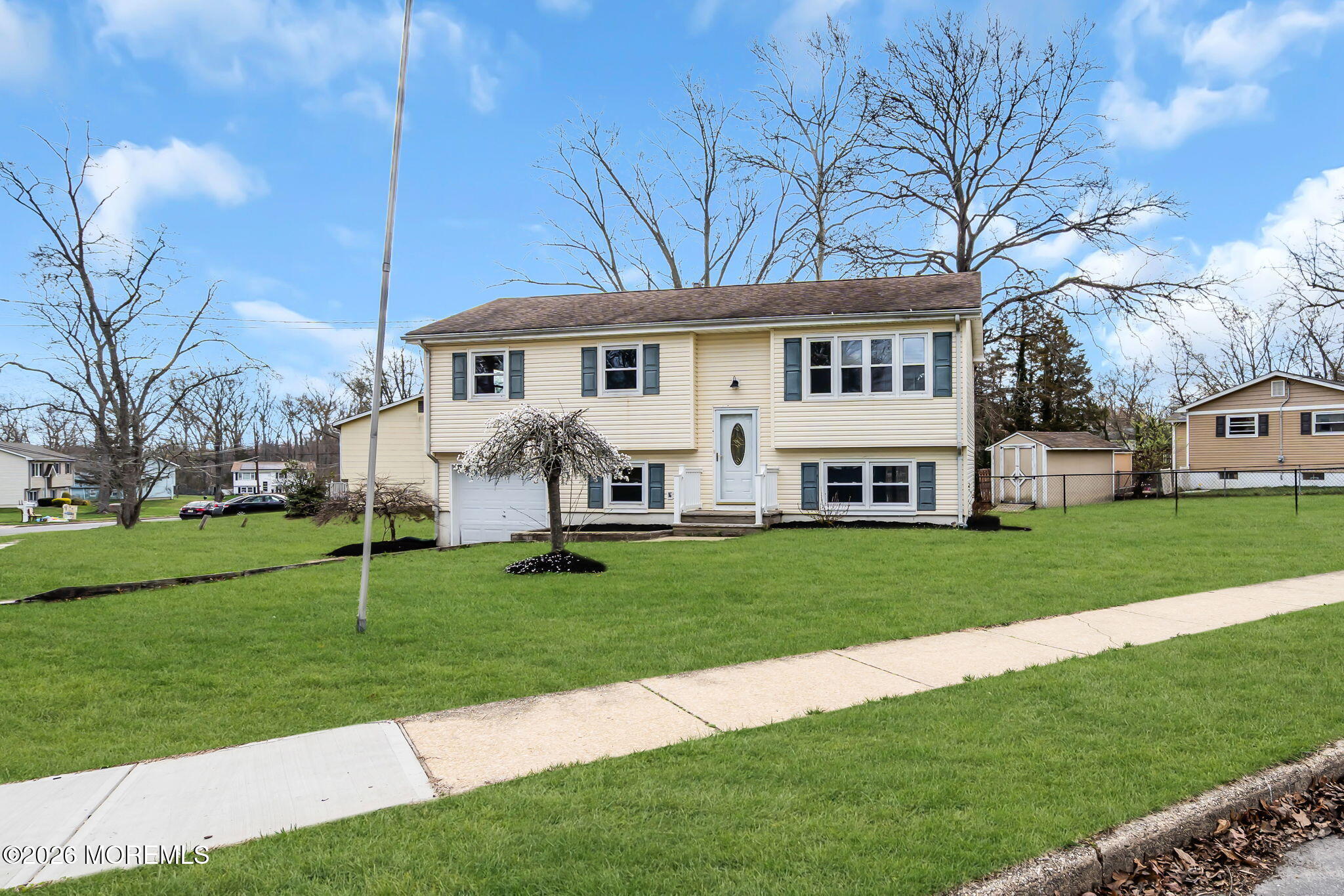 7 Spruce Terrace Jackson, NJ 08527 - Photo 2 of 49 a front view of a house with a garden