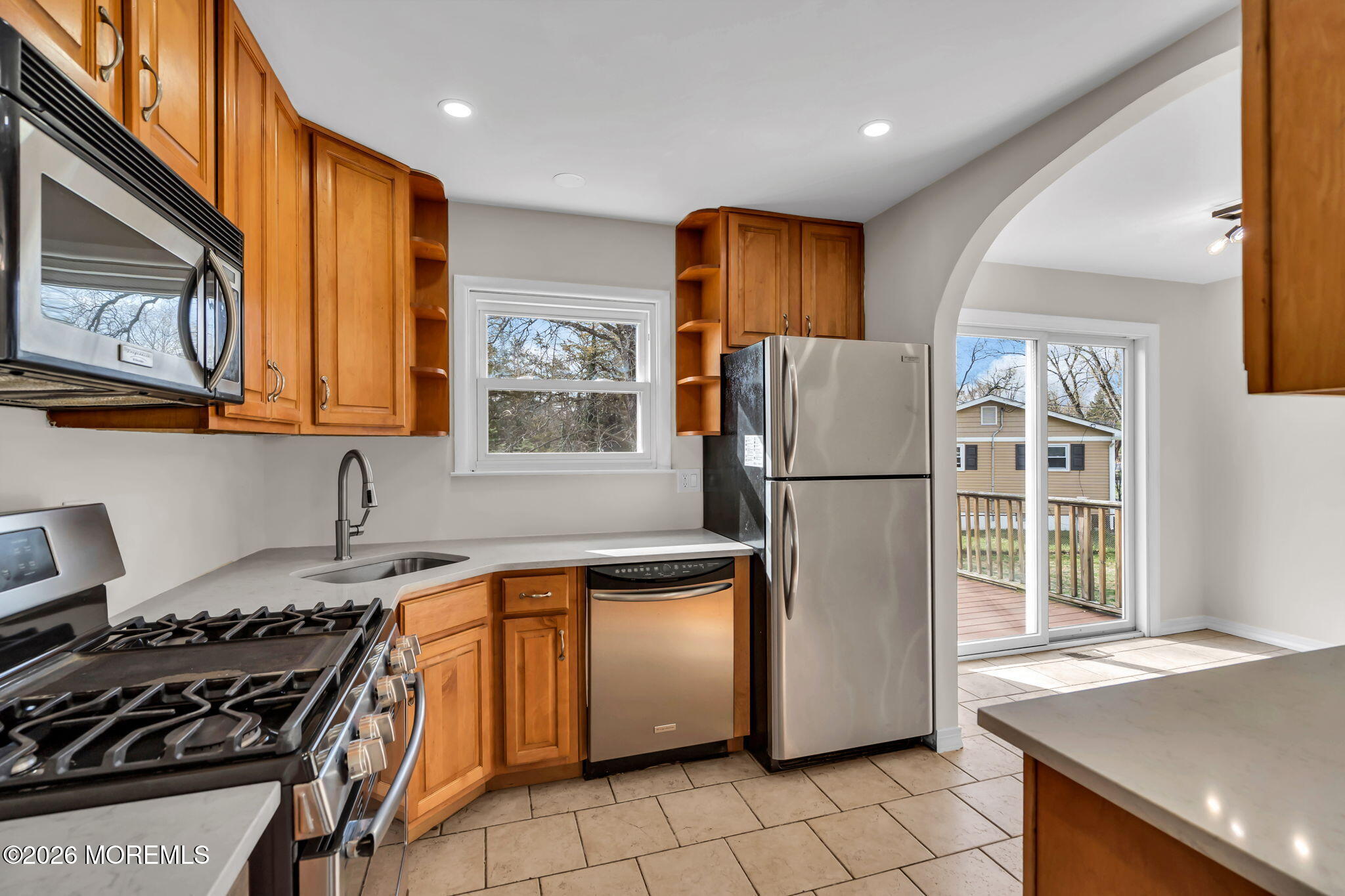 7 Spruce Terrace Jackson, NJ 08527 - Photo 23 of 49 a kitchen with stainless steel appliances granite countertop a refrigerator a sink a stove and white cabinets