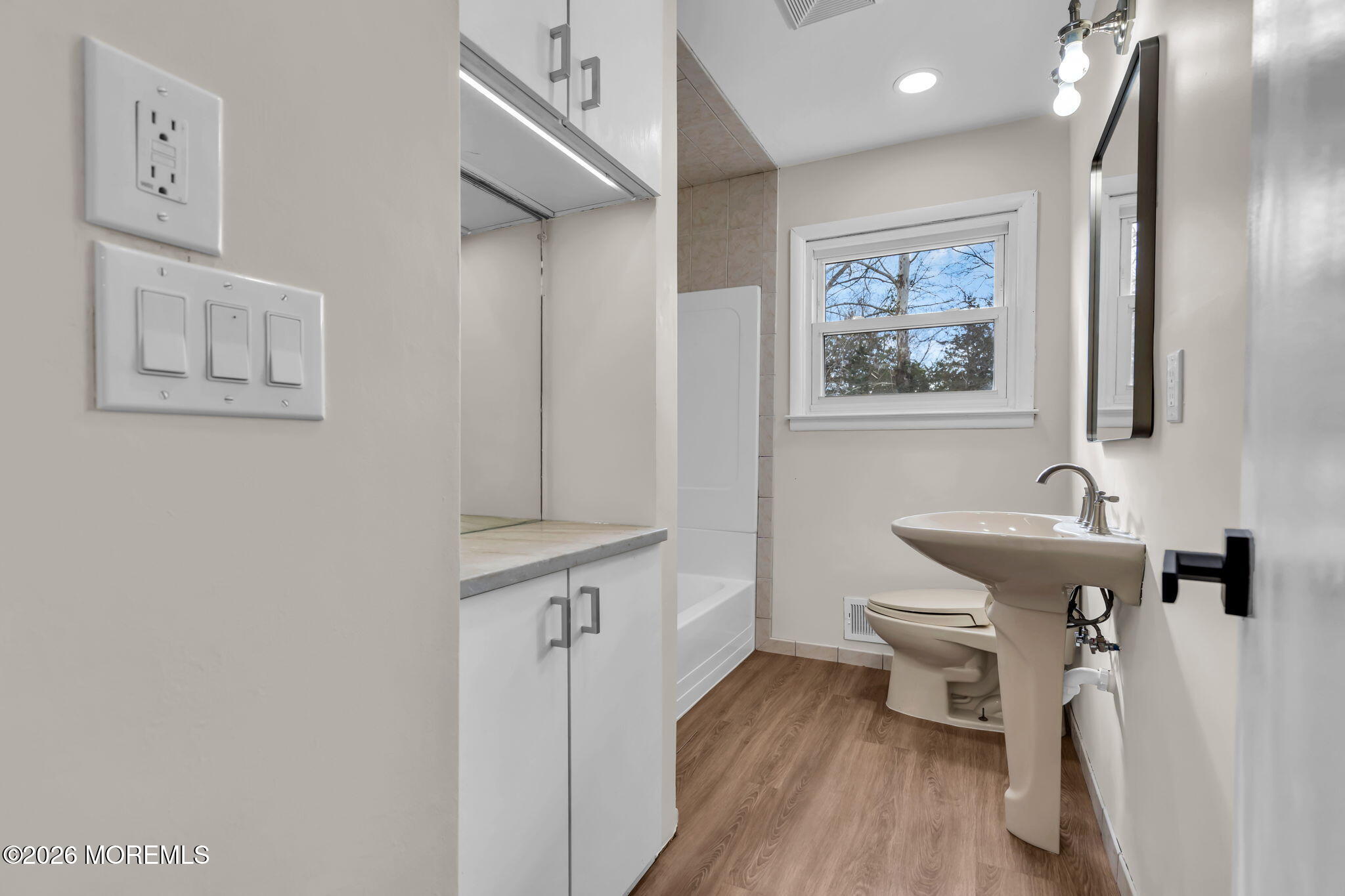 7 Spruce Terrace Jackson, NJ 08527 - Photo 27 of 49 a bathroom with a sink and a mirror