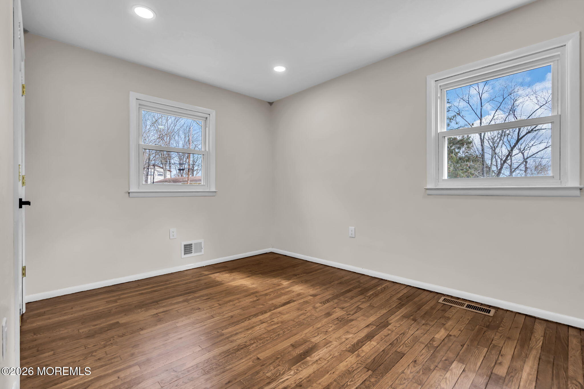 7 Spruce Terrace Jackson, NJ 08527 - Photo 31 of 49 a view of an empty room with wooden floor and a window