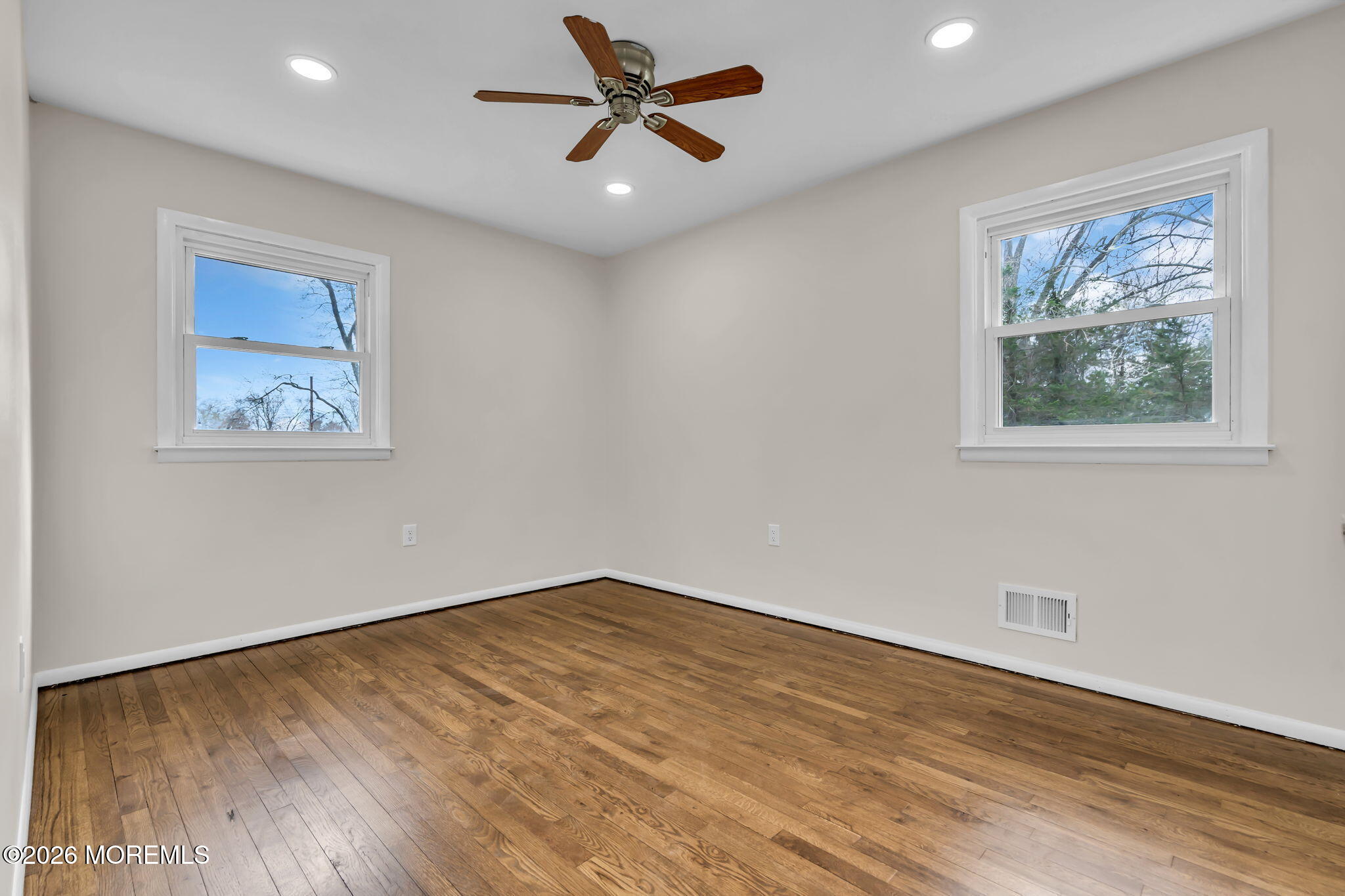 7 Spruce Terrace Jackson, NJ 08527 - Photo 33 of 49 a view of an empty room with wooden floor and a ceiling fan
