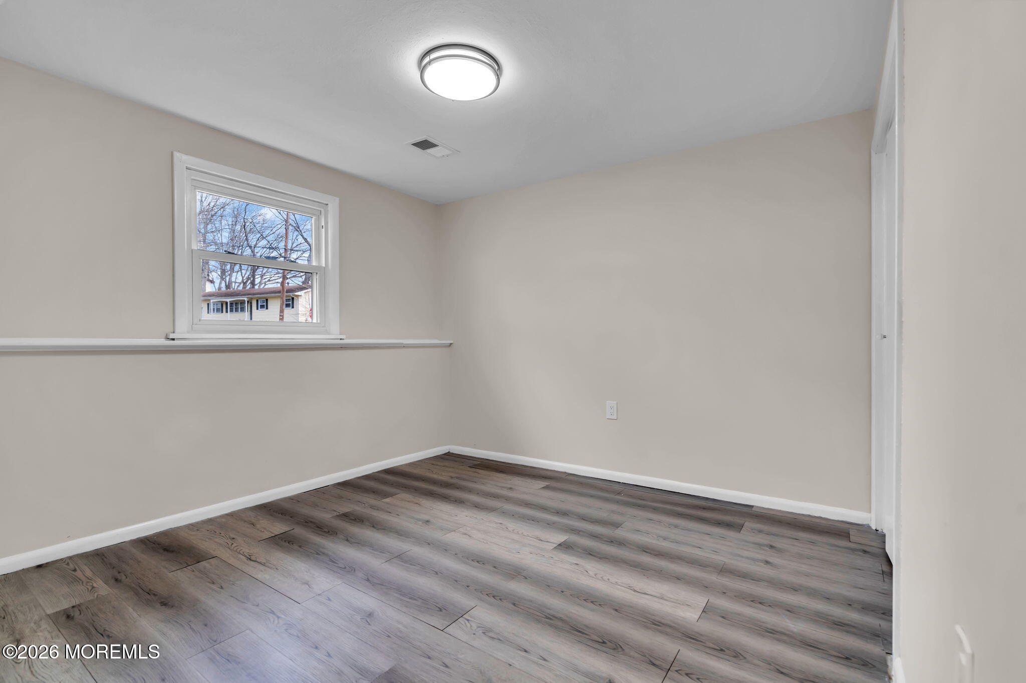 7 Spruce Terrace Jackson, NJ 08527 - Photo 37 of 49 an empty room with a workbench