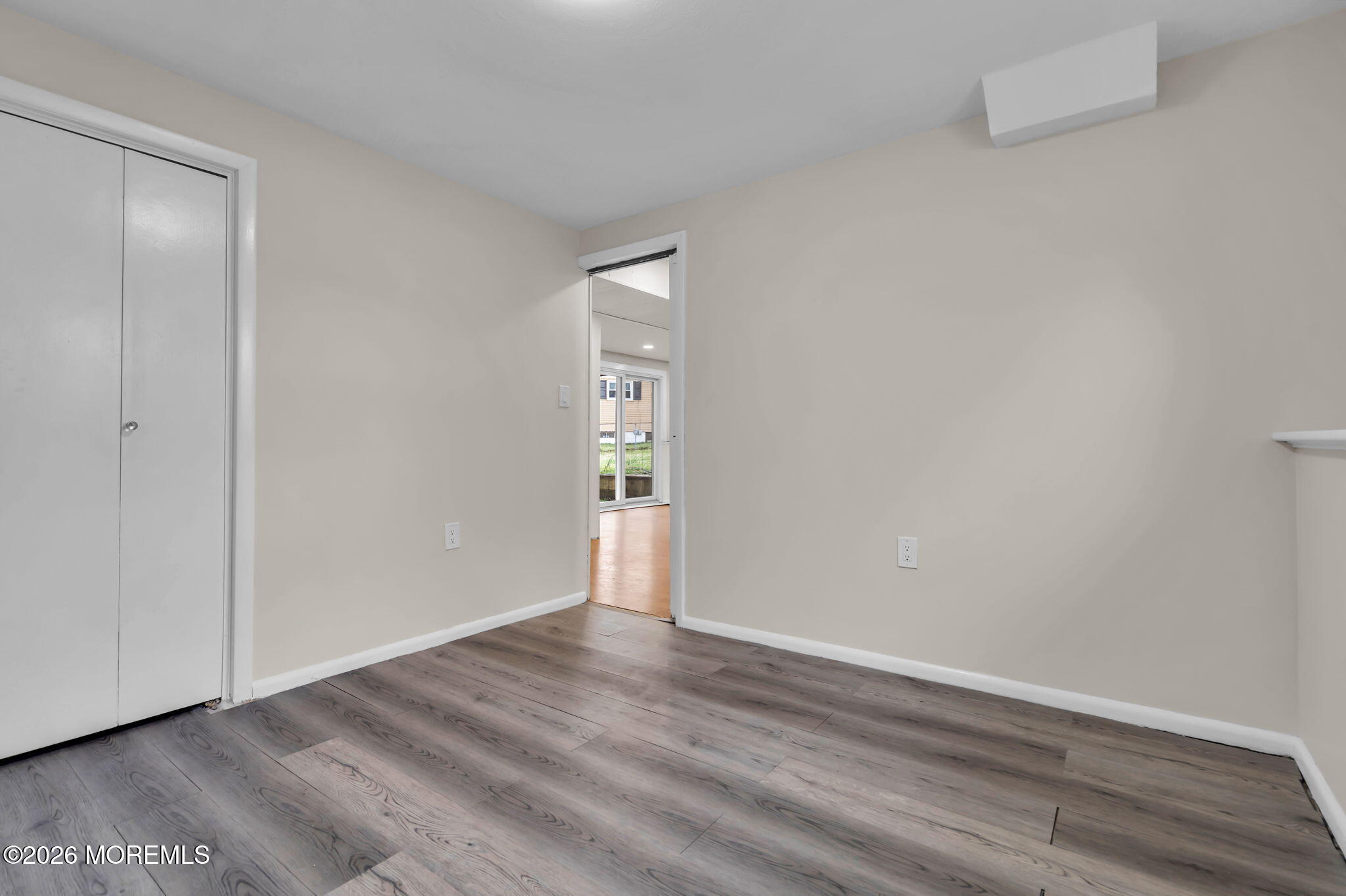 7 Spruce Terrace Jackson, NJ 08527 - Photo 38 of 49 a view of an empty room with wooden floor