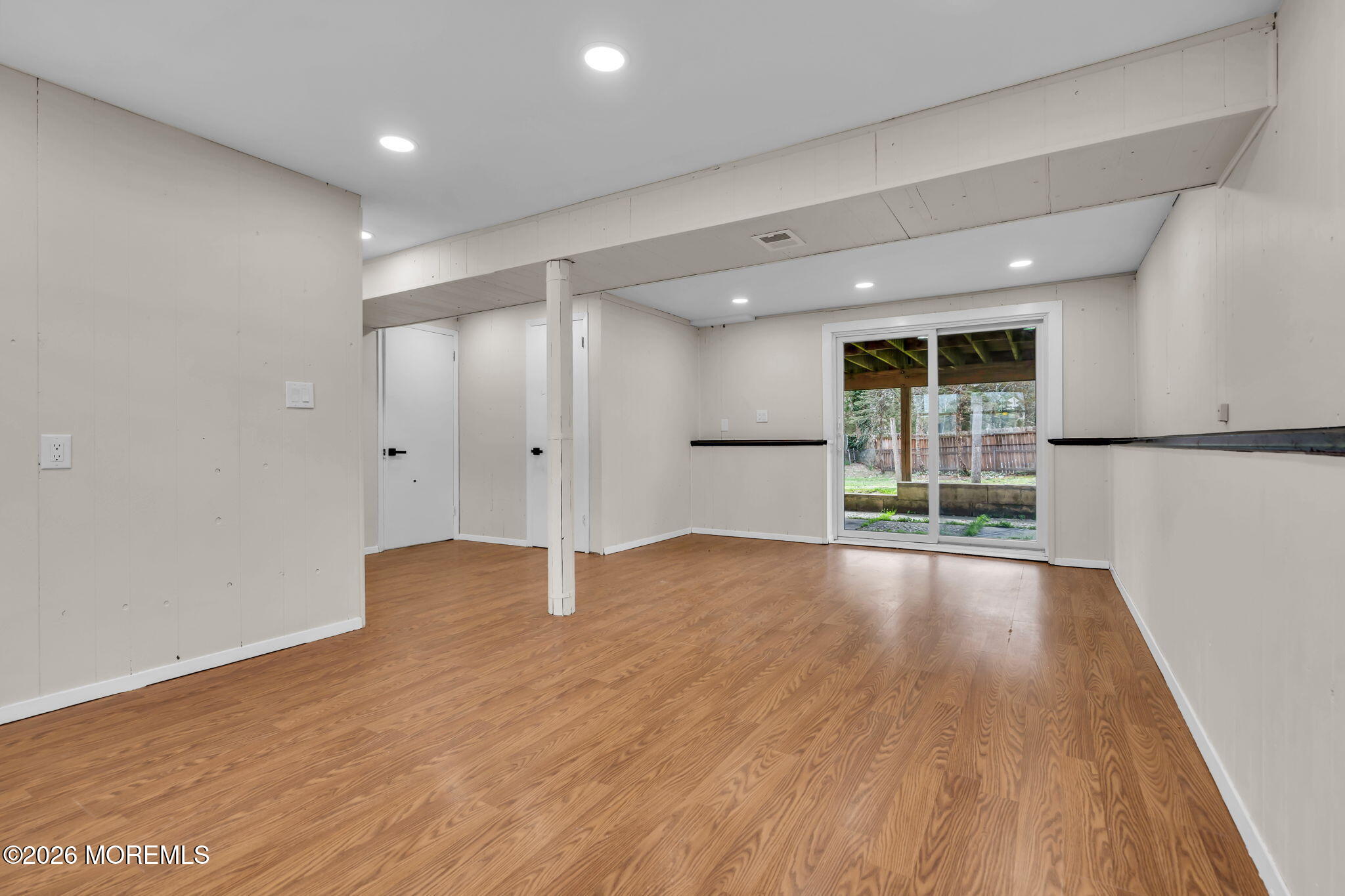 7 Spruce Terrace Jackson, NJ 08527 - Photo 39 of 49 a view of an empty room with wooden floor and a window