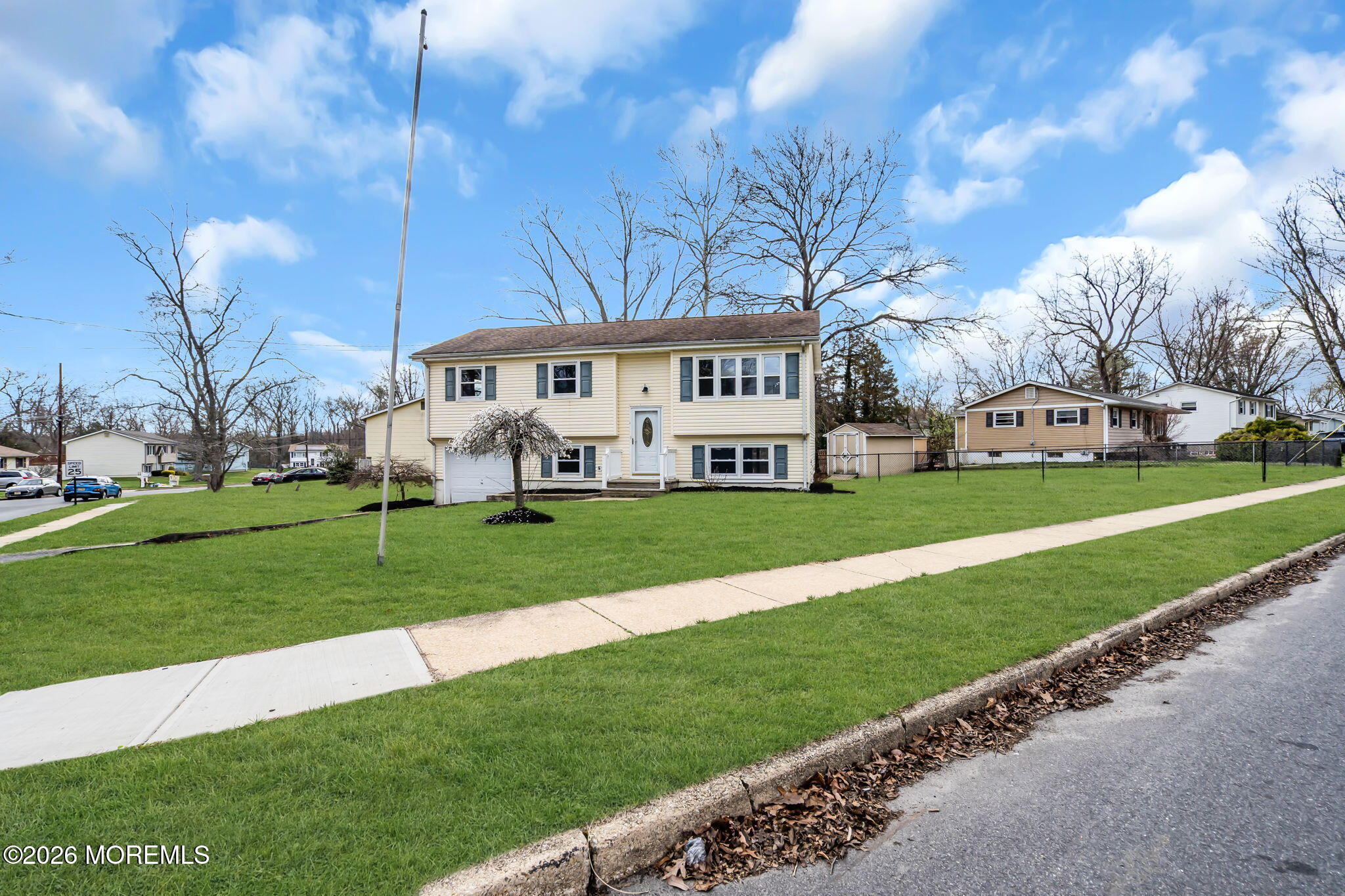 7 Spruce Terrace Jackson, NJ 08527 - Photo 5 of 49 a view of a white house with a big yard and large trees