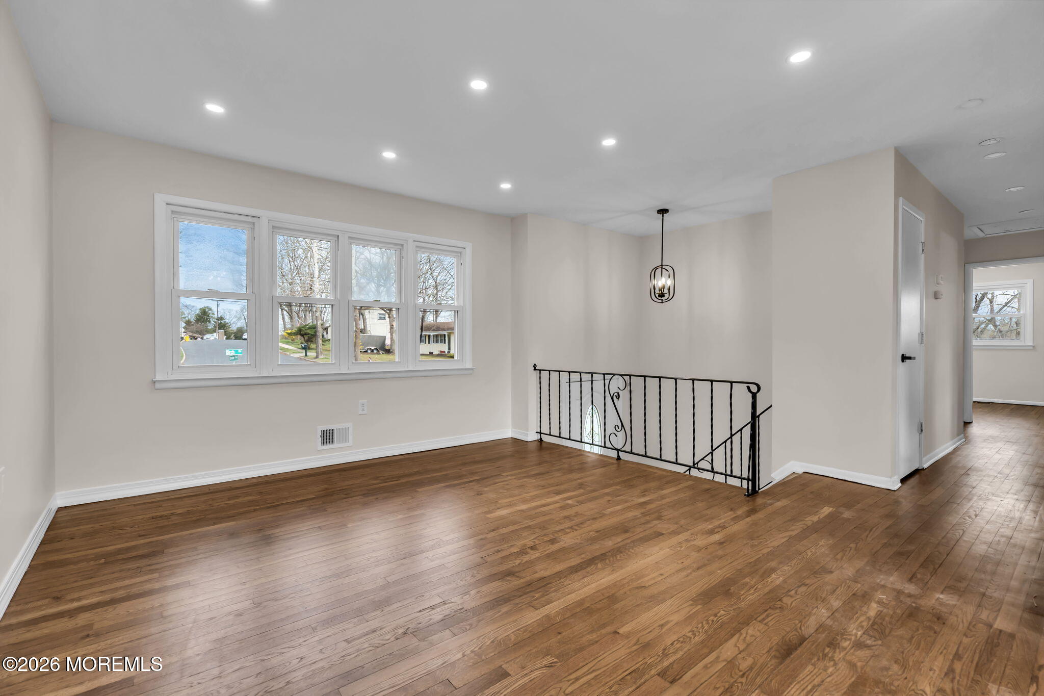 7 Spruce Terrace Jackson, NJ 08527 - Photo 9 of 49 a view of an empty room with wooden floor and a window
