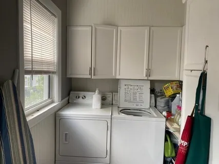 a view of storage and utility room with washer and dryer