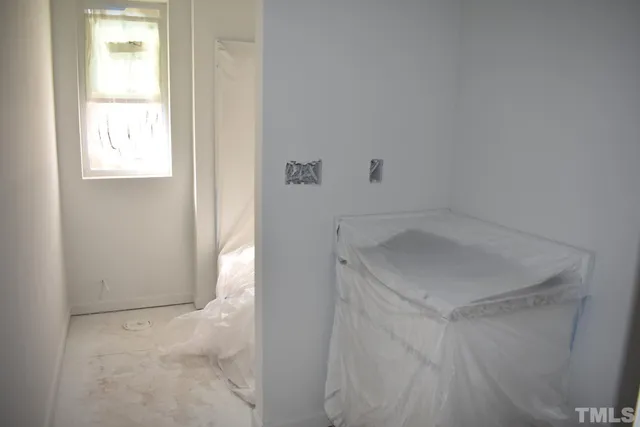 a bathroom with a sink window and shower