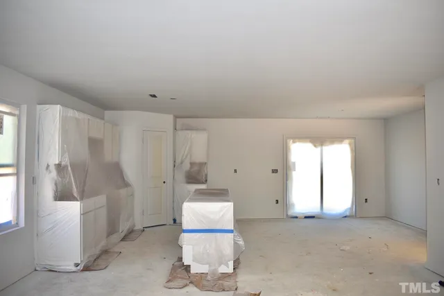 a living room with furniture and a gate