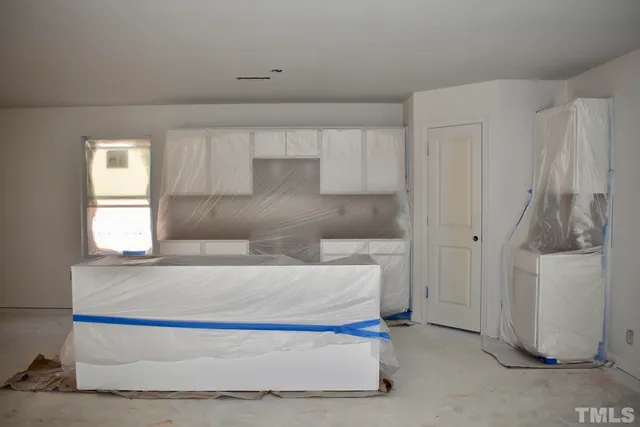 a living room with a couch and a window