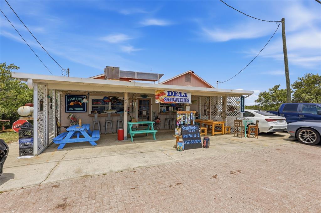 505 3rd Street Cedar Key, FL 32625 - Photo 1 of 37 a view of a car park in front of house