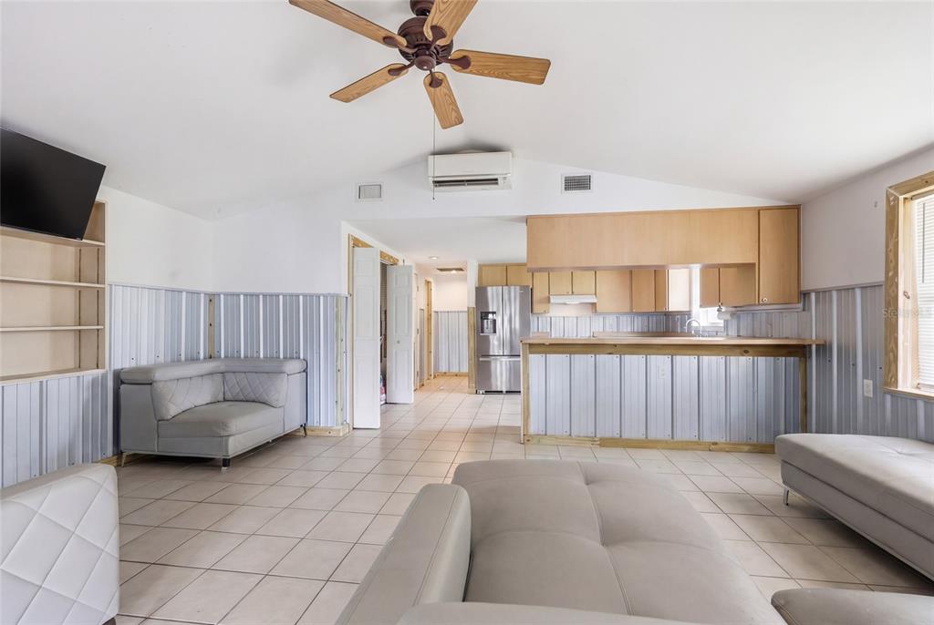 505 3rd Street Cedar Key, FL 32625 - Photo 13 of 37 a living room with furniture and a flat screen tv