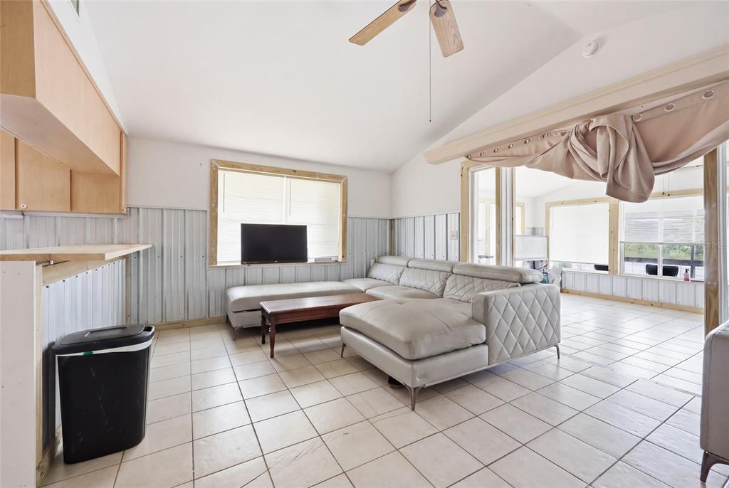 505 3rd Street Cedar Key, FL 32625 - Photo 14 of 37 a living room with furniture and a flat screen tv