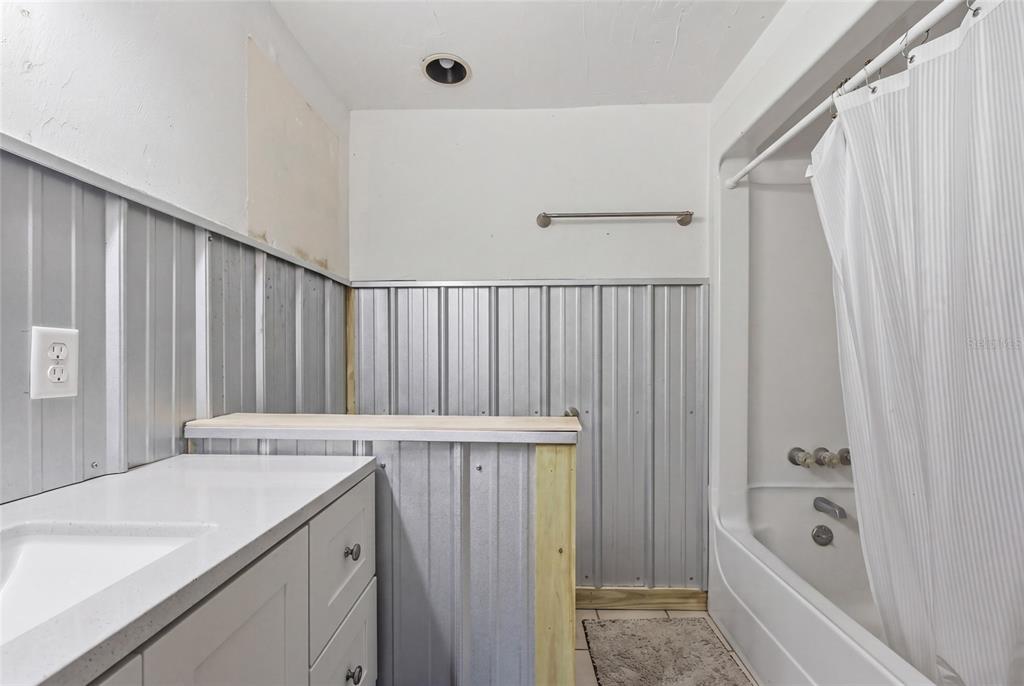 505 3rd Street Cedar Key, FL 32625 - Photo 20 of 37 a view of bathroom with bathtub and shower