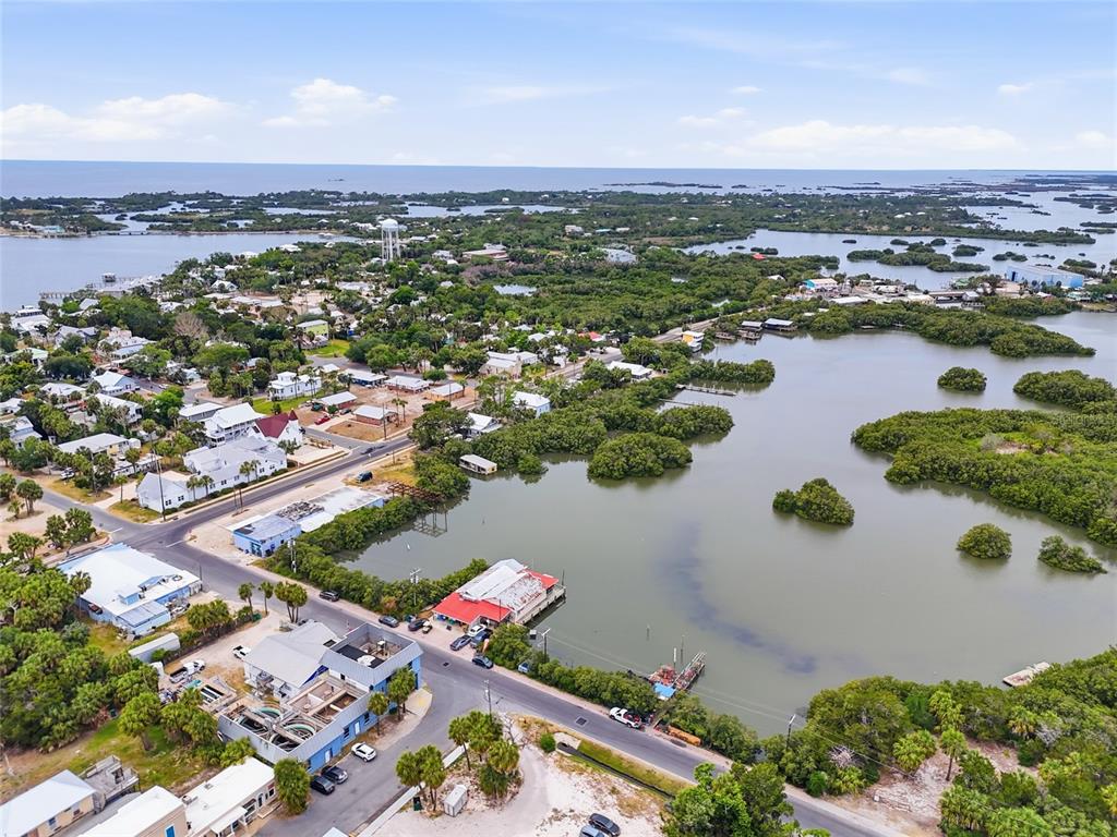 505 3rd Street Cedar Key, FL 32625 - Photo 2 of 37 an aerial view of residential houses with outdoor space