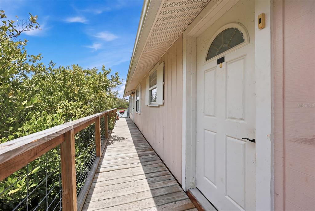 505 3rd Street Cedar Key, FL 32625 - Photo 24 of 37 a view of a balcony with wooden floor