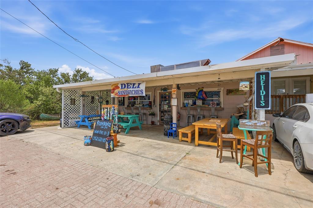 505 3rd Street Cedar Key, FL 32625 - Photo 28 of 37 a view of a chairs and table in a patio