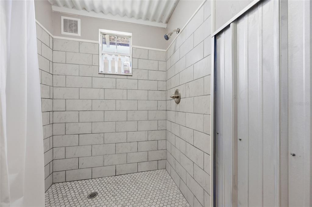 505 3rd Street Cedar Key, FL 32625 - Photo 32 of 37 a bathroom with a shower