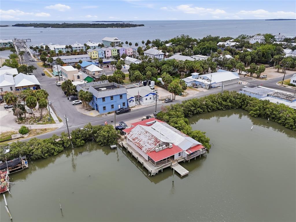 505 3rd Street Cedar Key, FL 32625 - Photo 33 of 37 an aerial view of a city with lake view
