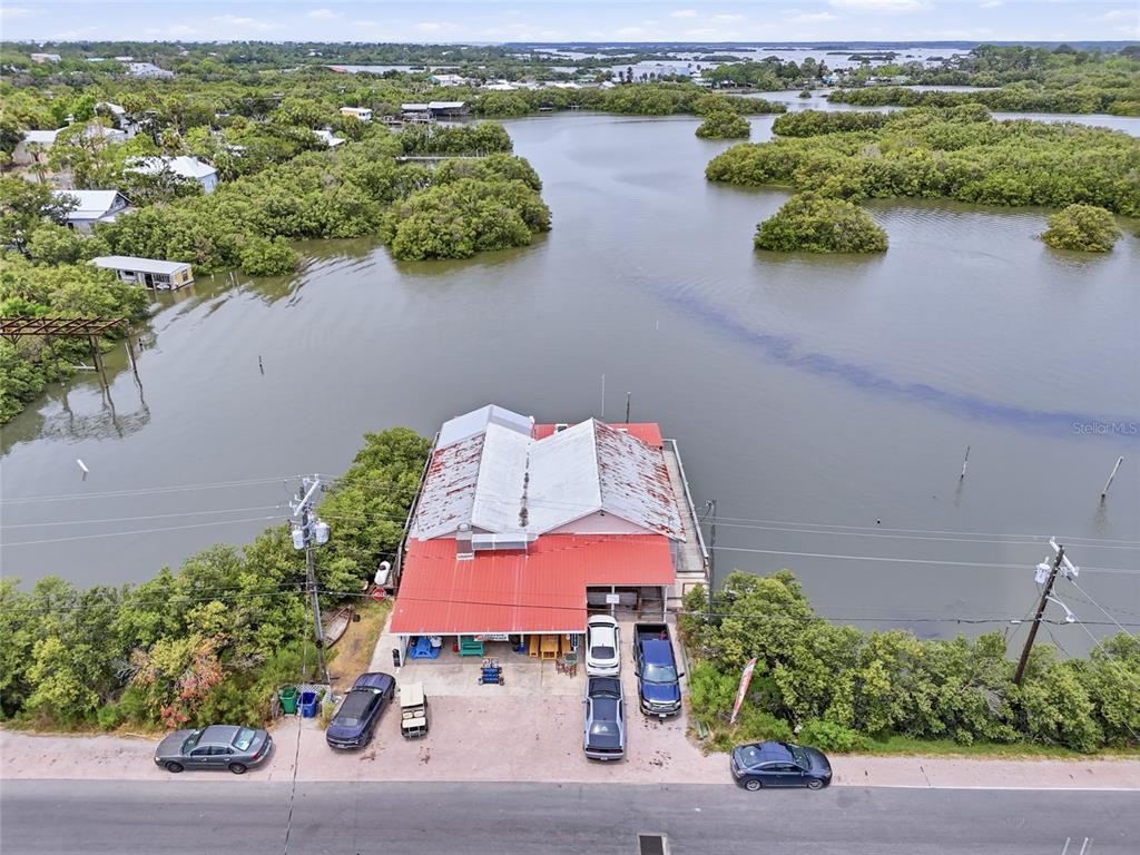 505 3rd Street Cedar Key, FL 32625 - Photo 36 of 37 an aerial view of a house with a lake view