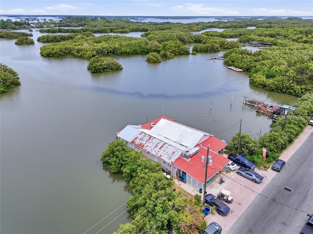 505 3rd Street Cedar Key, FL 32625 - Photo 37 of 37 an aerial view of a house with a lake view