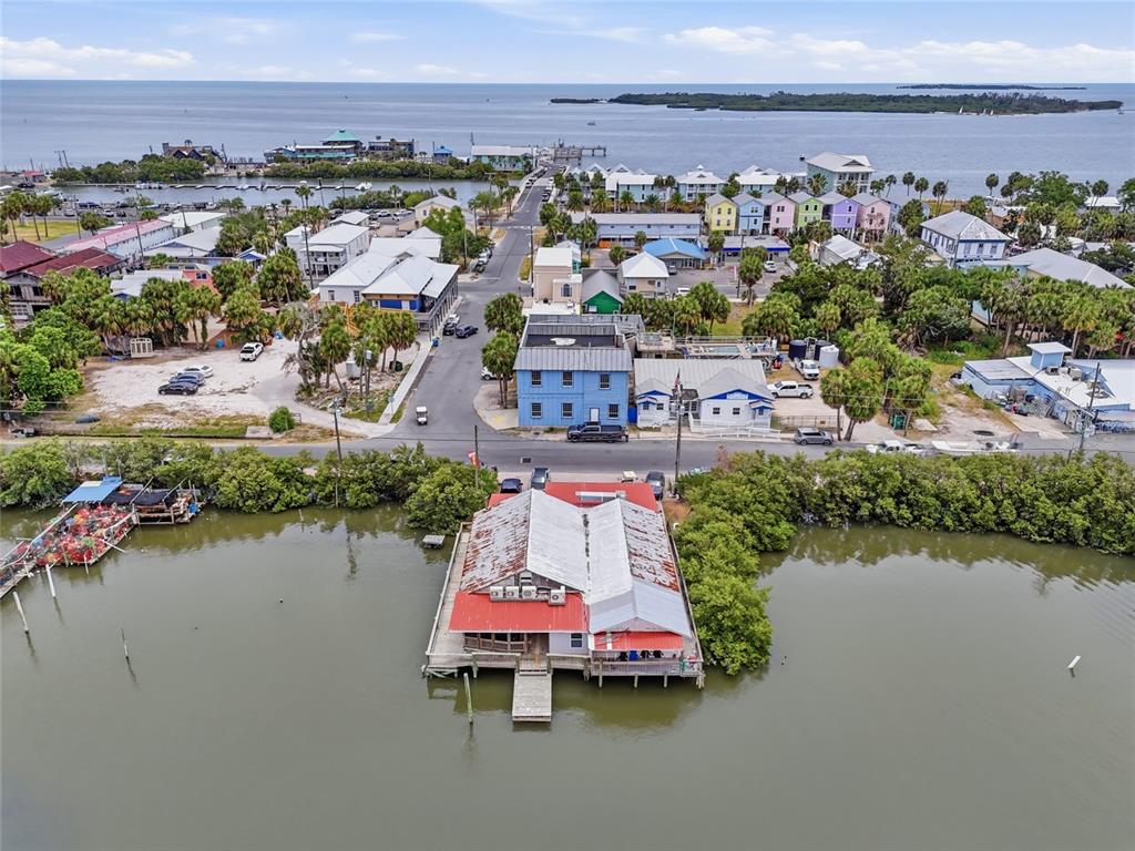 505 3rd Street Cedar Key, FL 32625 - Photo 4 of 37 an aerial view of lake and residential houses with outdoor space