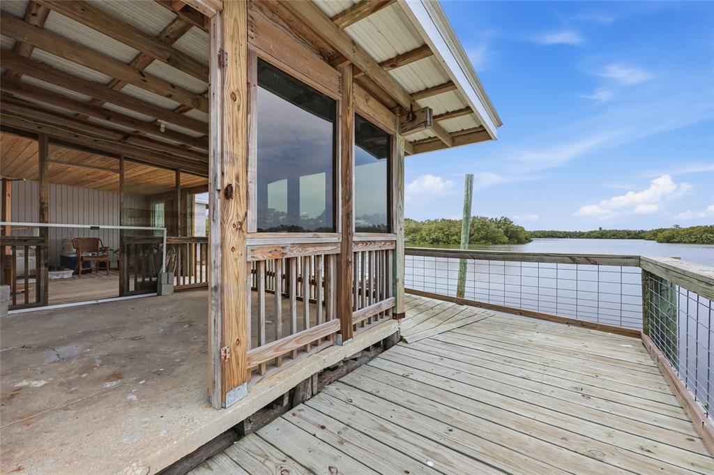 505 3rd Street Cedar Key, FL 32625 - Photo 6 of 37 a view of a balcony with wooden floor