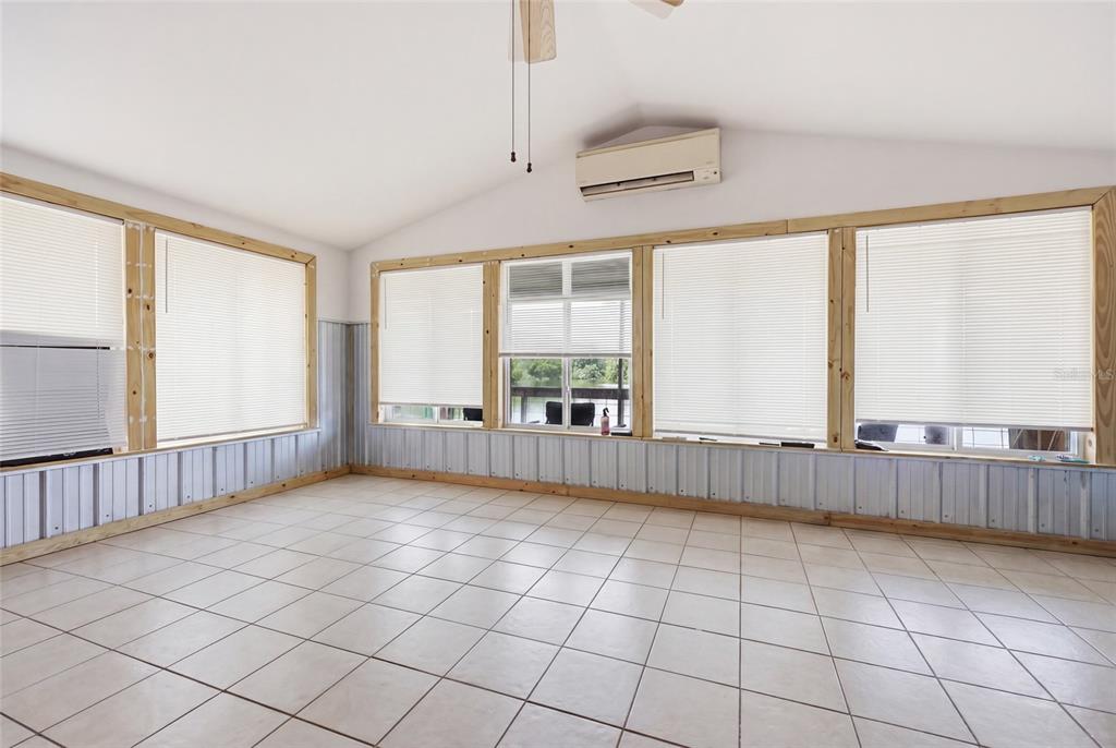 505 3rd Street Cedar Key, FL 32625 - Photo 10 of 37 a view of an empty room with a window