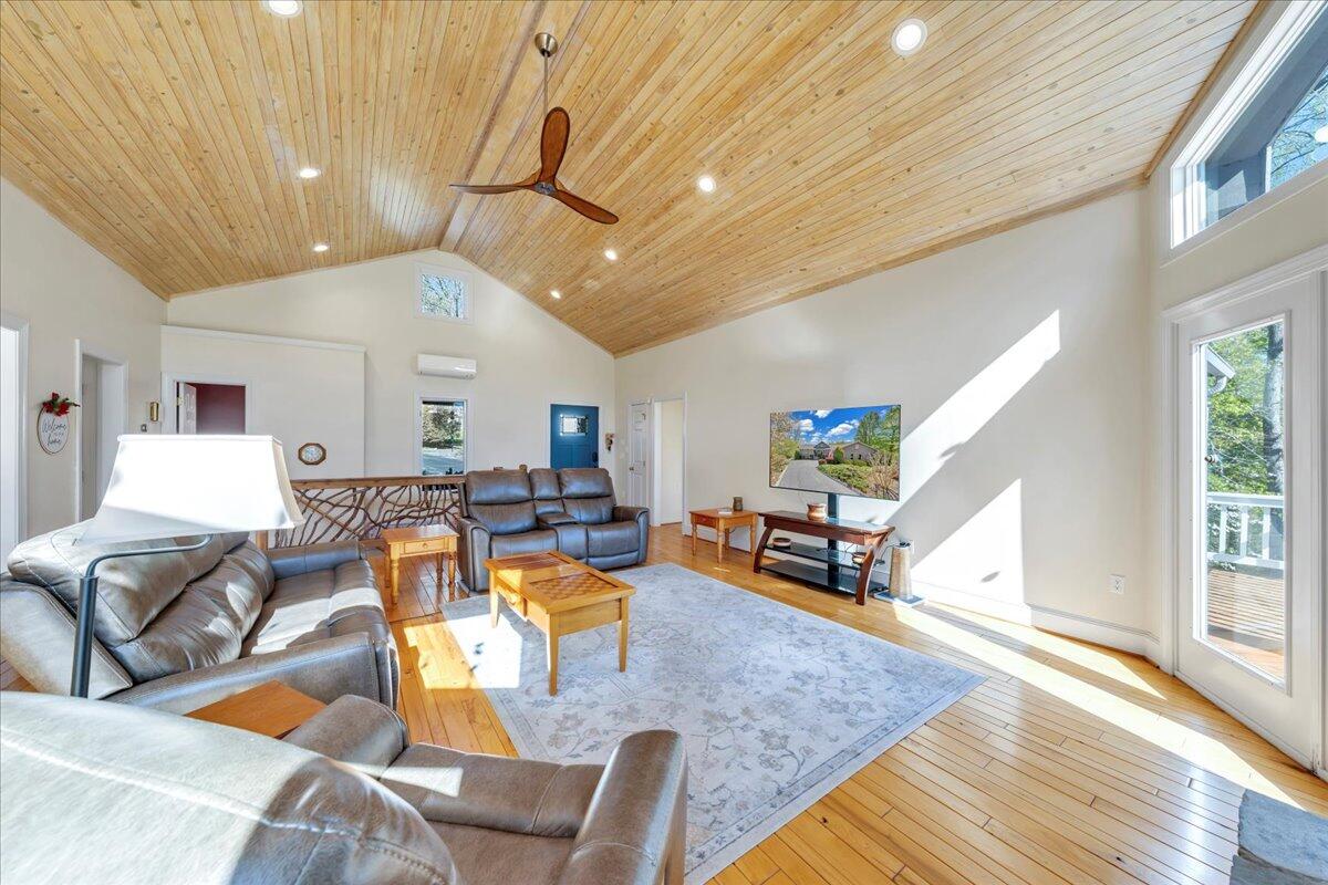 270 Forest Edge Road Wirtz, VA 24184 - Photo 11 of 79 a living room with furniture kitchen view and a large window