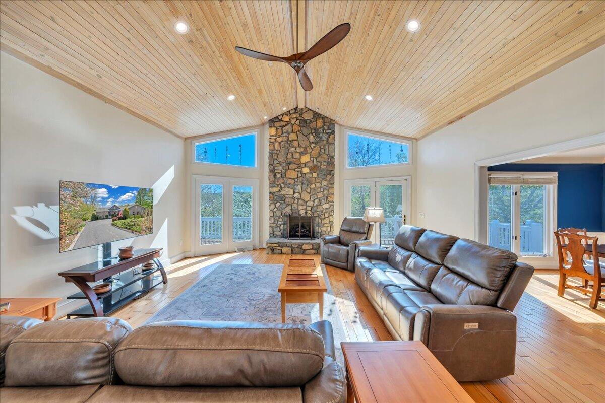 270 Forest Edge Road Wirtz, VA 24184 - Photo 12 of 79 a living room with furniture a chandelier and a fireplace