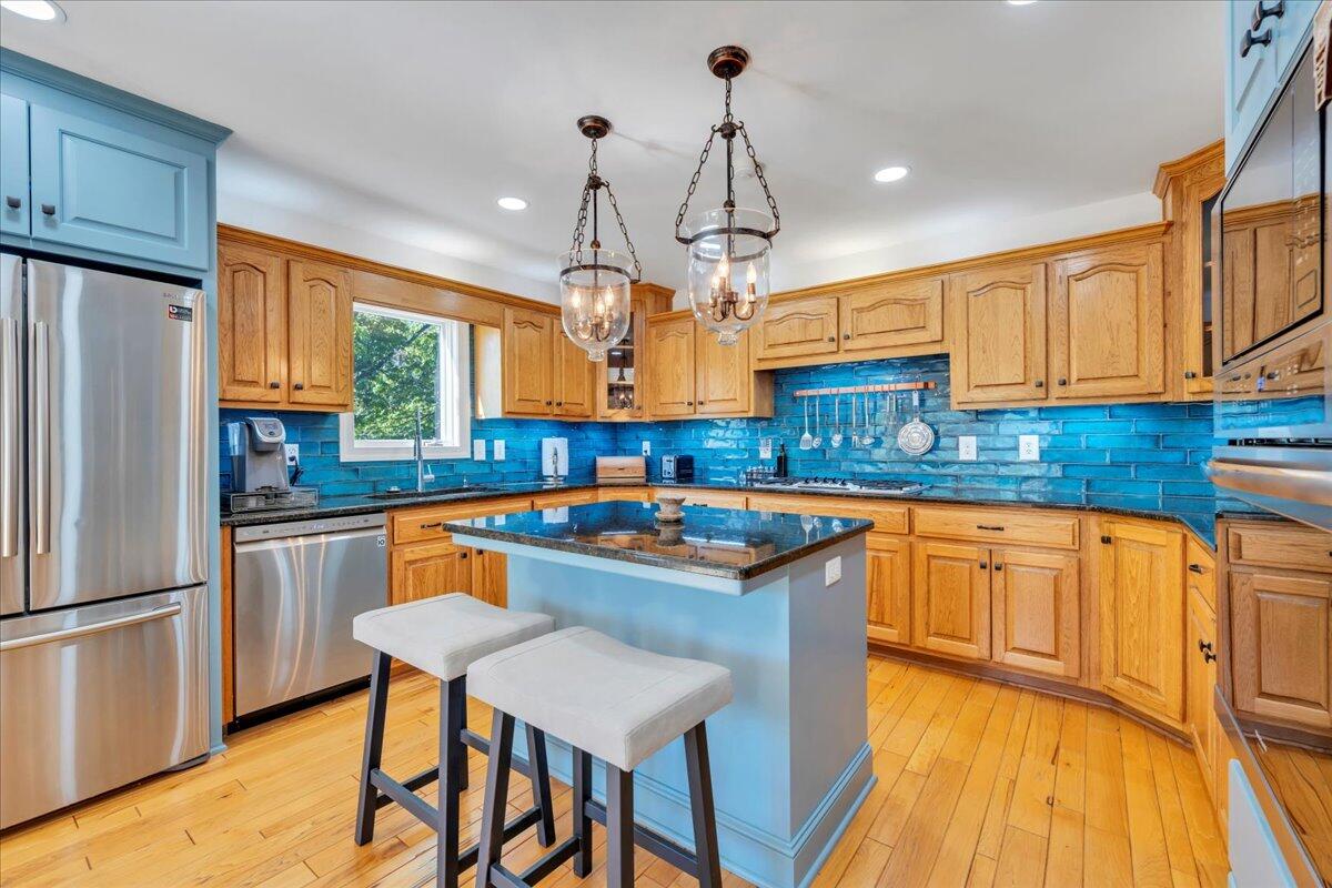 270 Forest Edge Road Wirtz, VA 24184 - Photo 17 of 79 a kitchen with stainless steel appliances granite countertop a sink a stove and refrigerator