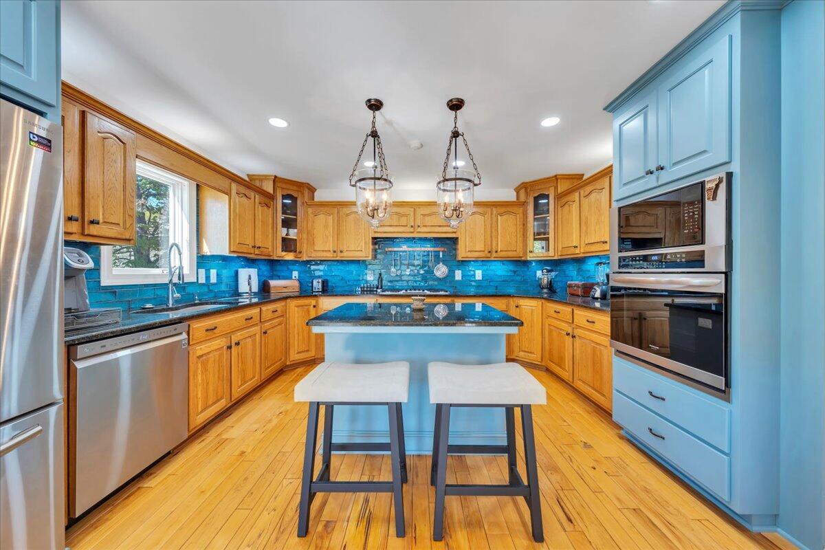 270 Forest Edge Road Wirtz, VA 24184 - Photo 18 of 79 a kitchen with stainless steel appliances kitchen island granite countertop a sink and cabinets