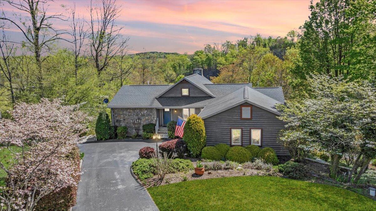 270 Forest Edge Road Wirtz, VA 24184 - Photo 2 of 79 a front view of a house with a yard