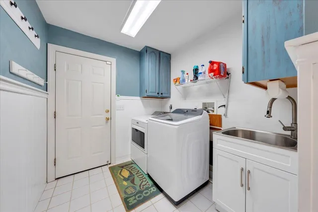 a bathroom with a sink vanity granite and a mirror