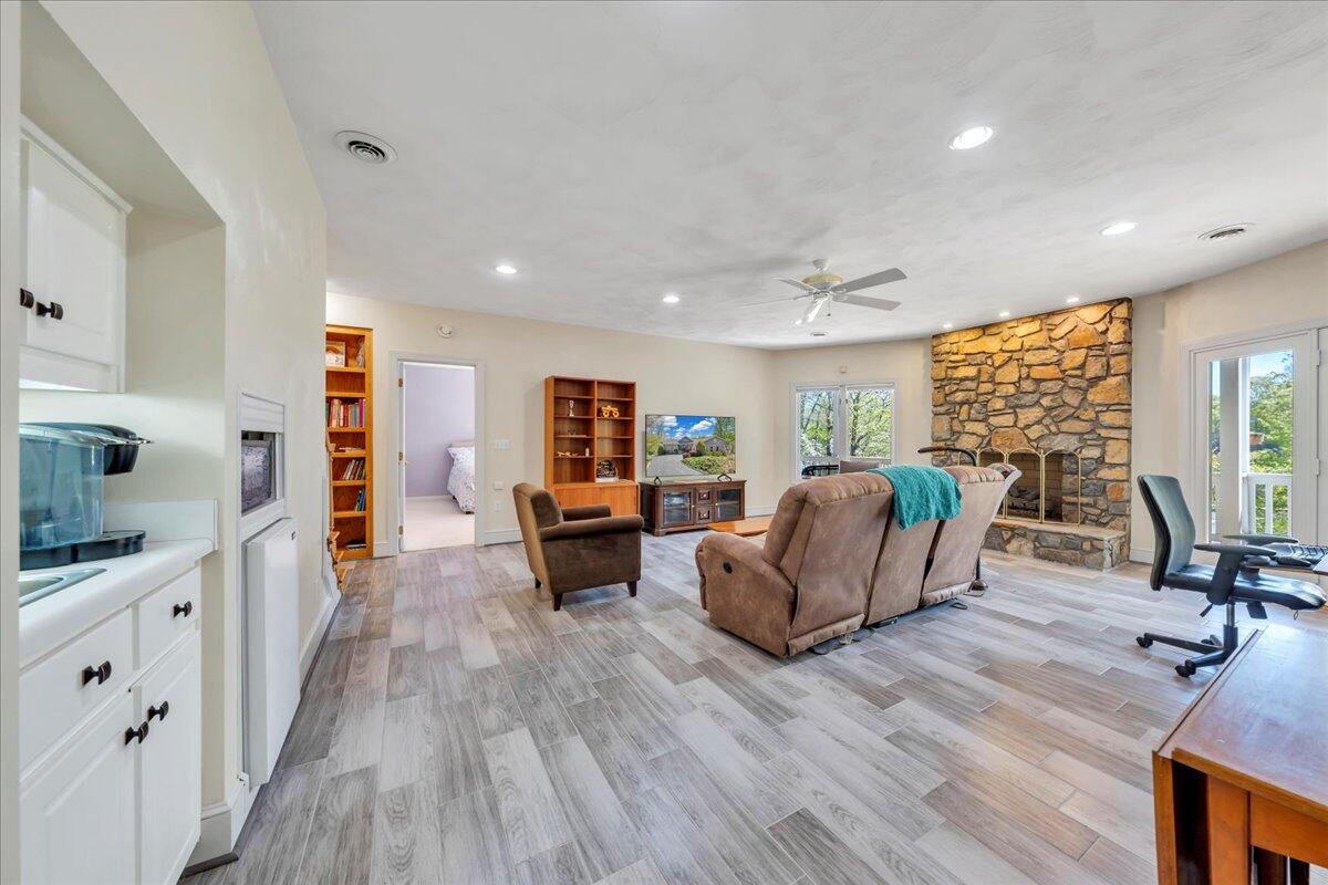 270 Forest Edge Road Wirtz, VA 24184 - Photo 36 of 79 a living room with furniture and a wooden floor