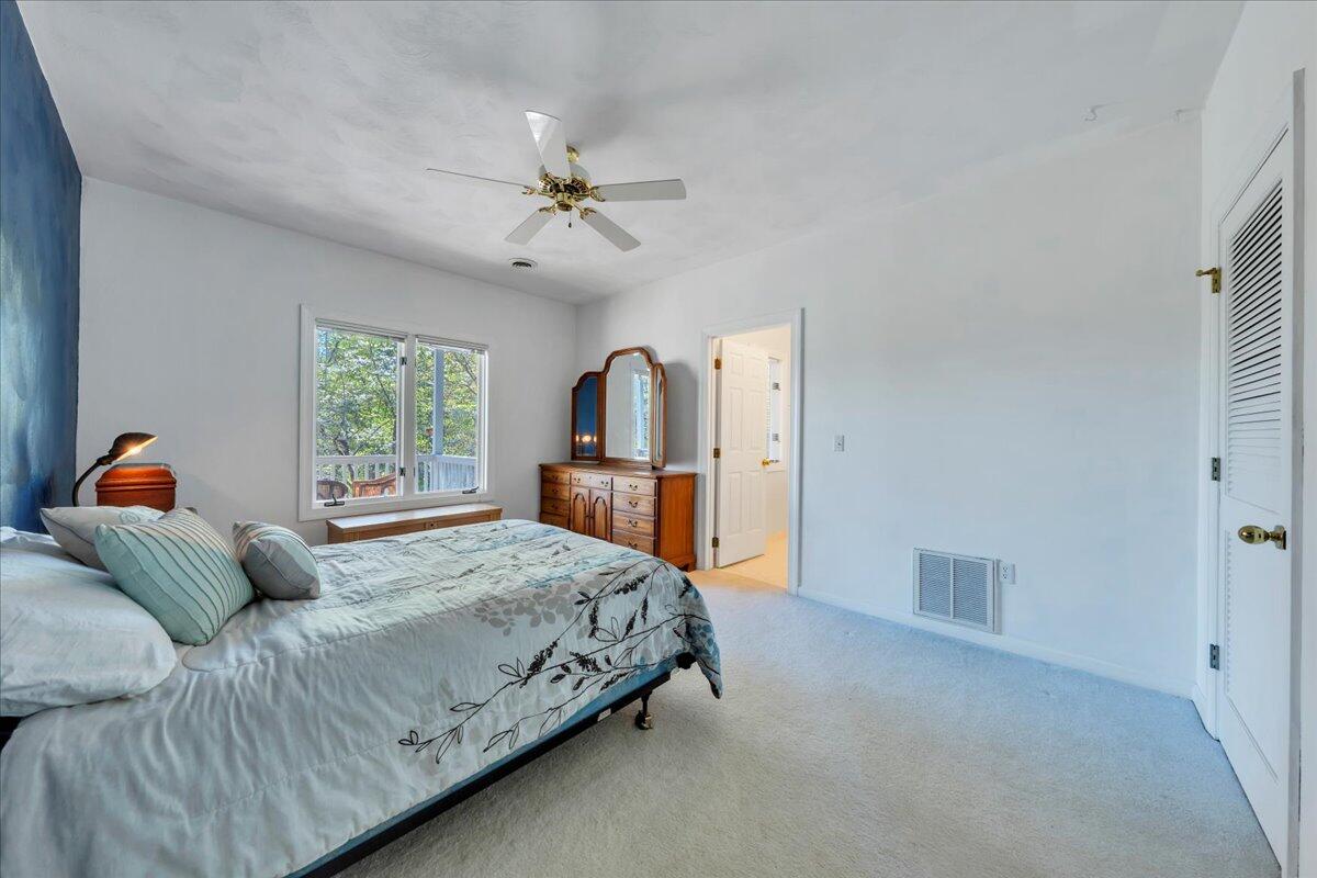 270 Forest Edge Road Wirtz, VA 24184 - Photo 39 of 79 a bedroom with a large bed and a window