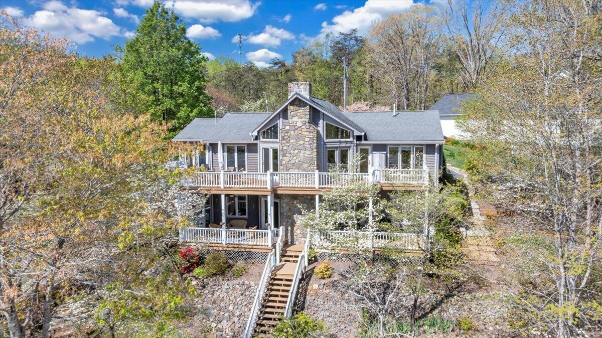 270 Forest Edge Road Wirtz, VA 24184 - Photo 69 of 79 a house with trees in the background