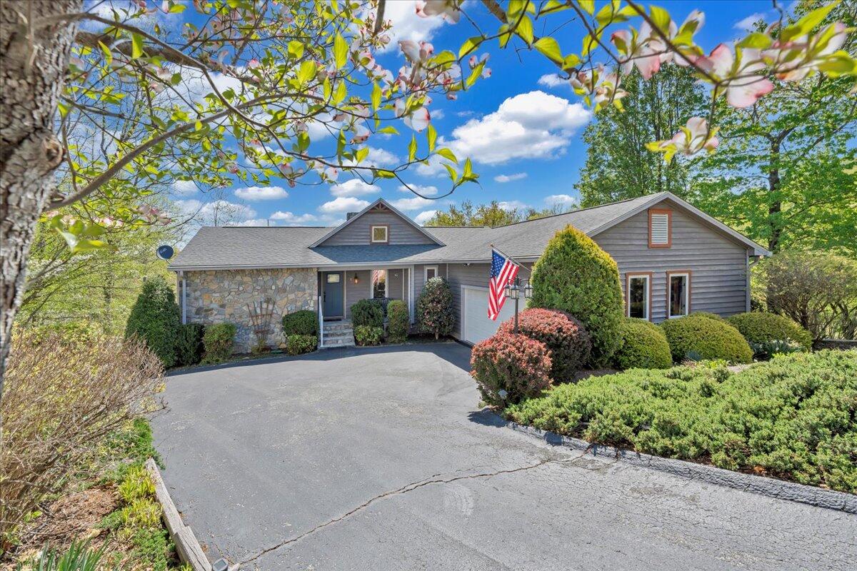270 Forest Edge Road Wirtz, VA 24184 - Photo 73 of 79 a front view of a house with a yard and potted plants